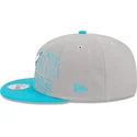 gorra-plana-gris-y-azul-snapback-9fifty-draft-edition-2023-de-charlotte-hornets-nba-de-new-era