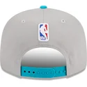 gorra-plana-gris-y-azul-snapback-9fifty-draft-edition-2023-de-charlotte-hornets-nba-de-new-era