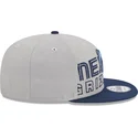 gorra-plana-gris-y-azul-marino-snapback-9fifty-draft-edition-2023-de-memphis-grizzlies-nba-de-new-era