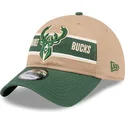 justerbar-brun-och-gron-kurvskarmkeps-9twenty-draft-2024-milwaukee-bucks-nba-fran-new-era