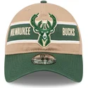 justerbar-brun-och-gron-kurvskarmkeps-9twenty-draft-2024-milwaukee-bucks-nba-fran-new-era
