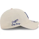 casquette-courbee-beige-ajustable-avec-logo-bleu-9twenty-linen-spring-training-fan-pack-2025-los-angeles-dodgers-mlb-new-era