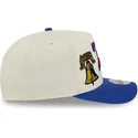 casquette-courbee-beige-et-bleue-snapback-9fifty-a-frame-precurved-hardwood-classics-philadelphia-76ers-nba-new-era